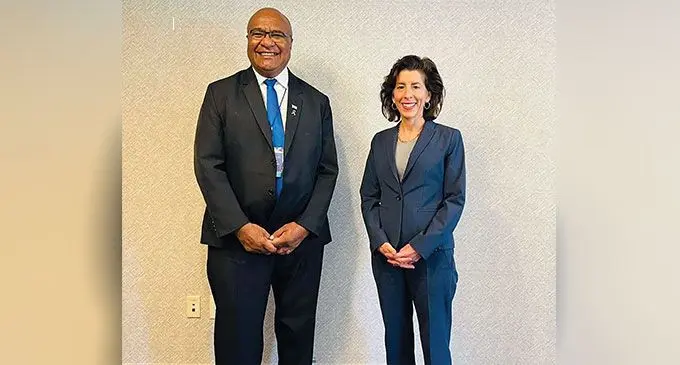 Minister for Trade, Manoa Kamikamica (left), with U.S commerce secretary, ambassador Sarah Bianchi. 