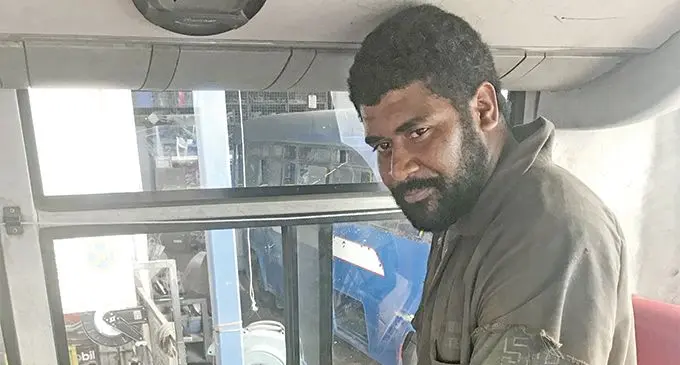 Shore bus mechanic Poasa Levu shows the damage to the bus. Photo: Wati Talebula.