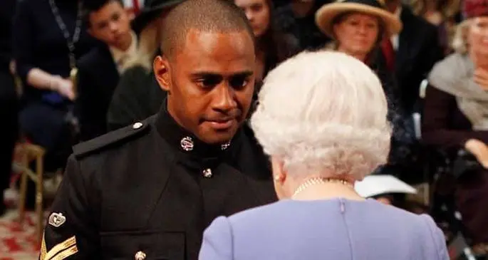 Fijian-born Corporal Saimone Qasenivalu of the British Armed Forces with Her Majesty Queen Elizabeth in London, England