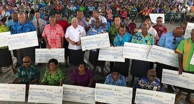 Prime Minister Voreqe Bainimarama with pine landowners who received their cheques on October 21, 2019, in Lautoka. Photo: Charles Chambers   