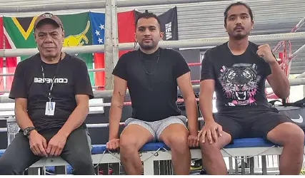 Amateur boxers with trainer Lepani Wilson (left).  