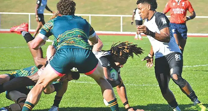 Swire Shipping Fijian Drua star Salestino Ravutaumada (with ball), is taken down by Australia Men’s 7s players during their scrimmaging session at Churchill Park, Lautoka on June 18, 2024 in preparation for the 2024 Paris Olympics. Photo: Waisea Nasokia