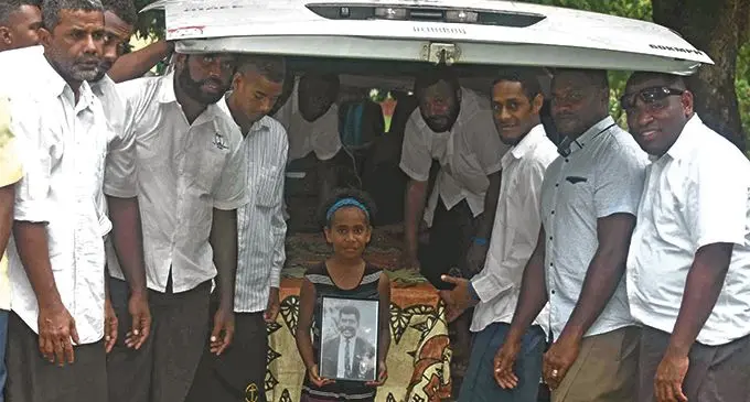 Familes bid farewell to former National rep Peniame Naresia at Narewa in Nadi yesterday. Photo: WAISEA NASOKIA