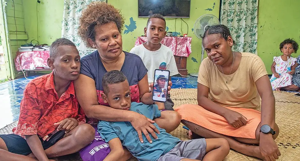 The family of deceased Tevita Tui (inset) from left: Aminisitai Rokovesa 11, Losalini Marama (mother), Tevita Tui 6, Alipate Baleisuva, 9 and Litiana Rokovesa,15 at their family home in Suvavou,  Lami on December 24, 2023. Photo: Leon Lord