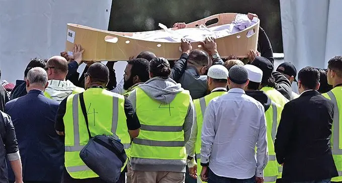 The coffin of the first victim from the Christchurch terrorist attack arrives for the burial ceremony at Memorial Park Cemetery, Christchurch.