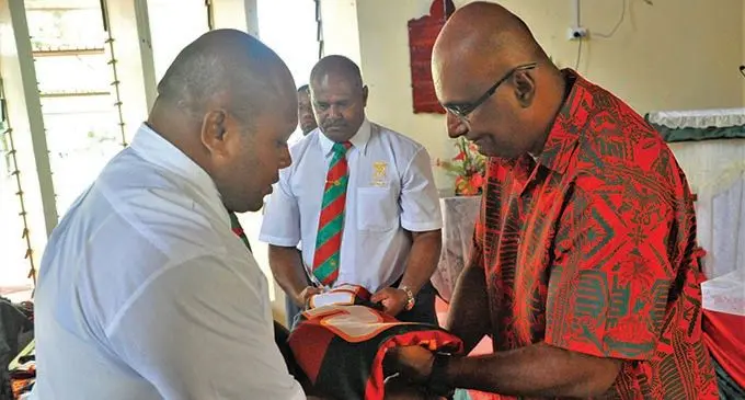 Republic of Fiji Military Forces (RFMF) deputy commander Brigadier- General Mohammed Aziz (right) hands over the jersey of captain Sireli Ledua while team manager Major Elia Rokowailoa looks on during the jersey presentation at the Queen Elizabeth Barrack chapel in Nabua, Suva, on November 21, 2019. Photo: RFMF Media