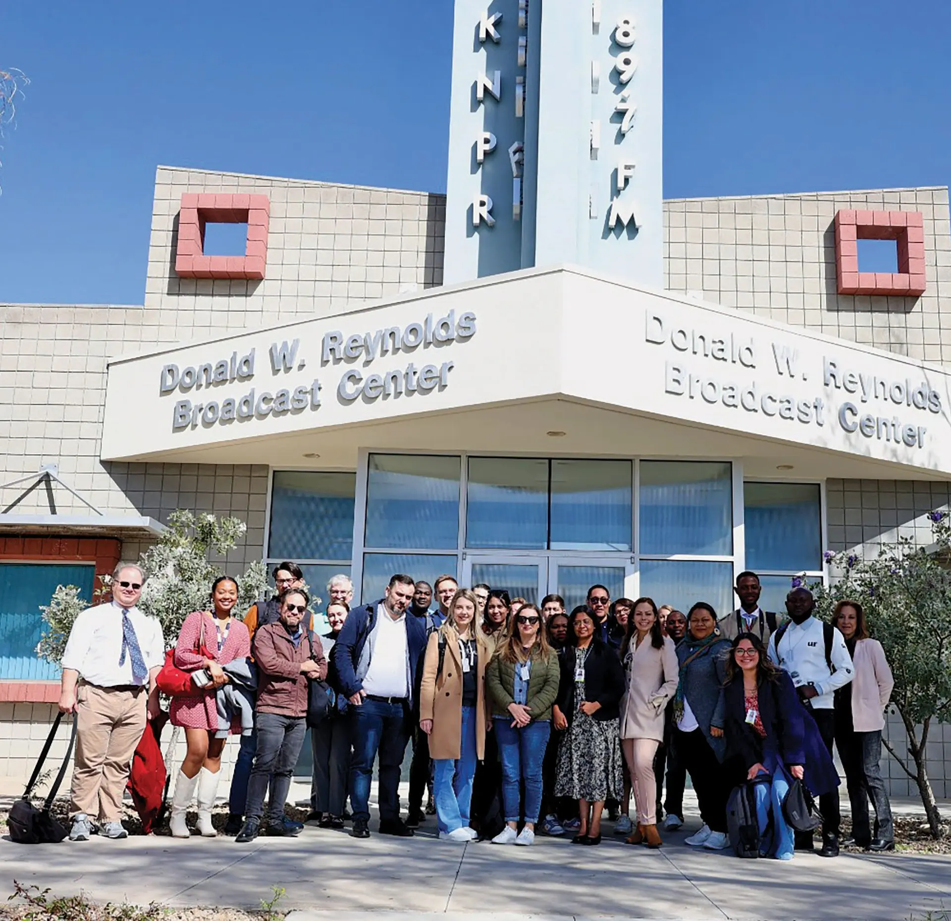 Journalists from around the world with the Nevada Public Radio staff outside its office.
