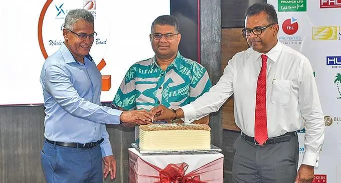 From left: Fijian Holdings Limited chief executive officer Jaoji Koroi, Reserve Bank of Fiji Governor Ariff Ali and FHL acting chairman and Permanent Secretary to the Office of the Prime Minister Yogesh Karan at the FHL boardroom on December 7, 2022. Photo: Fijian Holdings Limited