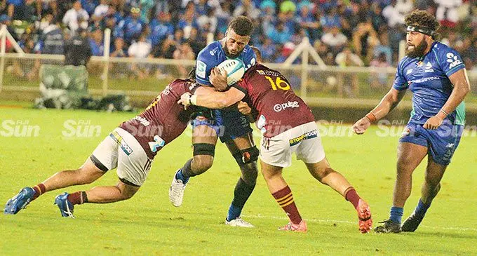Swire Shipping Fijian Drua’s blindside flanker Joseva Tamani is tackled by the Highlanders while loosehead prop Haereiti Hetet goes in to support during their Super Rugby Pacific clash at the ANZ Stadium, Suva, on April 30, 2022. Photo: Ronald Kumar