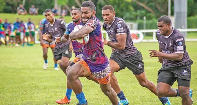 Tabadamu’s Daniele Cakaunivalu  runs away from the  BLK Stallions Jasa Veremalua during the Fiji Rugby Union Super Sevens Series 2021 at Sigatoka’s Lawaqa Park on the 22nd January 2021. Photo- Leon Lord