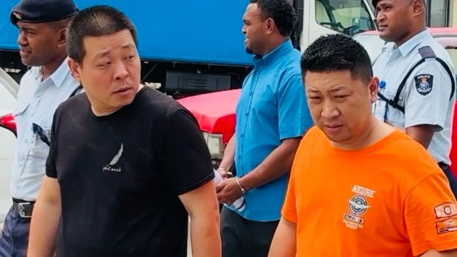 Chinese nationals Wang An (left) and Xu Qiang and Wang An at the Nadi Magistrates Court. 