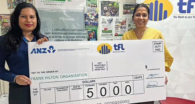 Telecom Fiji financial controller Ashika Nandni (left), presents the $5000 cheque to Frank Hilton Organisation chief executive officer Sureni Perera for the 2024 Frank Hilton Organisation Charity Wheelbarrow Race. Photo: Telecom Fiji