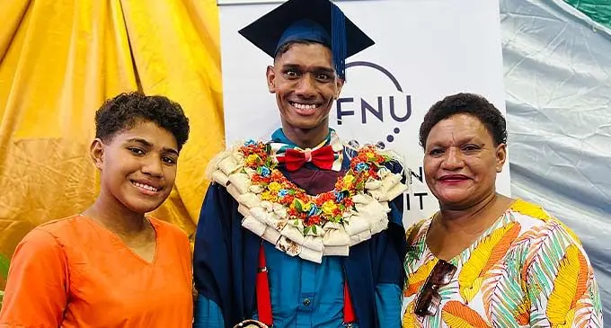 Iliesa Ratuva with his sister (left) Elesi Vehoka and mother Nanise Dirabe following the FNU graduation at the Vodafone Arena in Suva on December 22, 2022. Photo: Nolishma Narayan