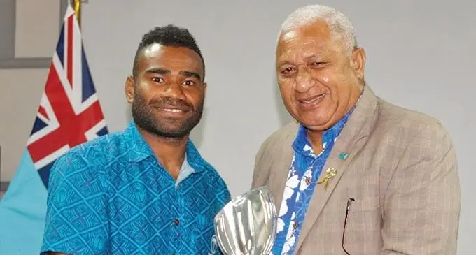 Seremaia “Jerry” Tuwai receives his World Rugby men’s player of the dedade award from Prime Minister and presdient of Fiji Rugby Union, Voreqe Bainimarama, in Suva on December 8, 2020. Photo: FRU Media 