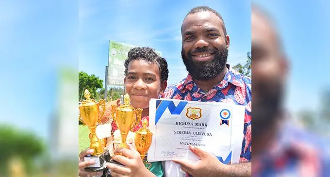 Sereima Uluivuda, 10 posed for a picture with her uncle, Josaia Uluivuda after the Suva Methodist Primary School graduation at the school in Suva on Tuesday. PC: RONALD KUMAR