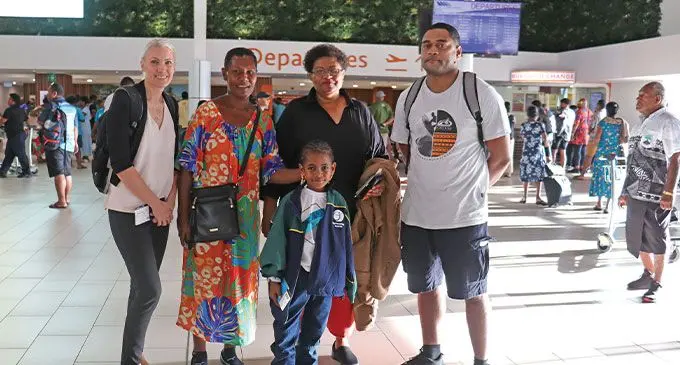 Aspen Medical executive director culture and performance, Mr Edwin Aisake with Elenoa Gukisawa at the Nadi International Airport. Elenoa Gukiasawa is flanked with (from left): Aspen Medical clinician Linda Jorgensen, Her grandmother Makelesi, clinicians Setaita Bulai and clinicians Dr Manoa Valeniyasana at the Nadi International Airport. Photo: Mereleki Nai
