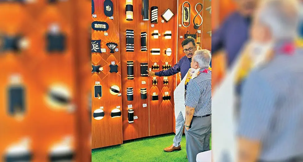 Al Hamd Smart Living managing director Ashfaaq Khan shows Labasa businessman Raman Lal the latest in their lighting range. Photo: Al Hamd 