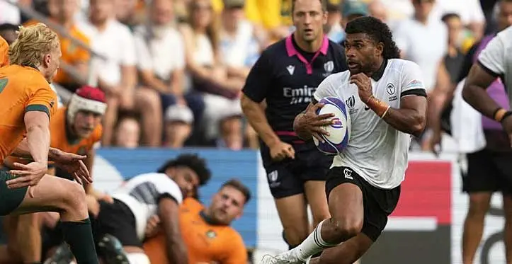 Fiji's scrum-half Simione Kuruvoli runs with the ball during the Rugby World Cup Pool C match against Australia at Stade Geoffroy-Guichard in Saint-Etienne, southeastern France, on September 17, 2023. Source: Francis Bompard, AFP