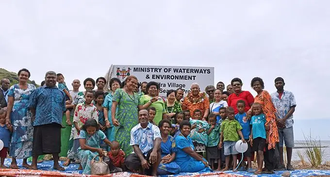 Prime Minister Voreqe Bainimarama with villagers of Nabukadra during the commissioning of the new seawall.