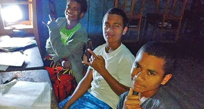 Her students studying at night.