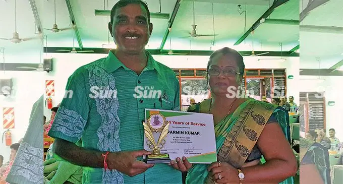 Sugar Cane Growers Fund loans officer for Tavua and Rakiraki, Parmin Kumar with his wife, Sunita Mala after receiving his 24 years of service award on March 28, 2022. Photo: Nicolette Chambers
