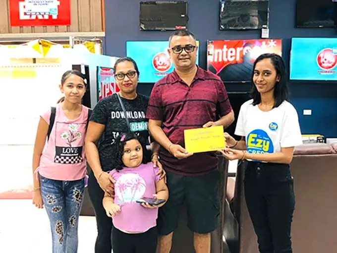 Ronald Kumar, with his family, received the prize certificate for a trip to Australia Easter on Saturday, June 11, 2022. Photo: Shreeya Verma