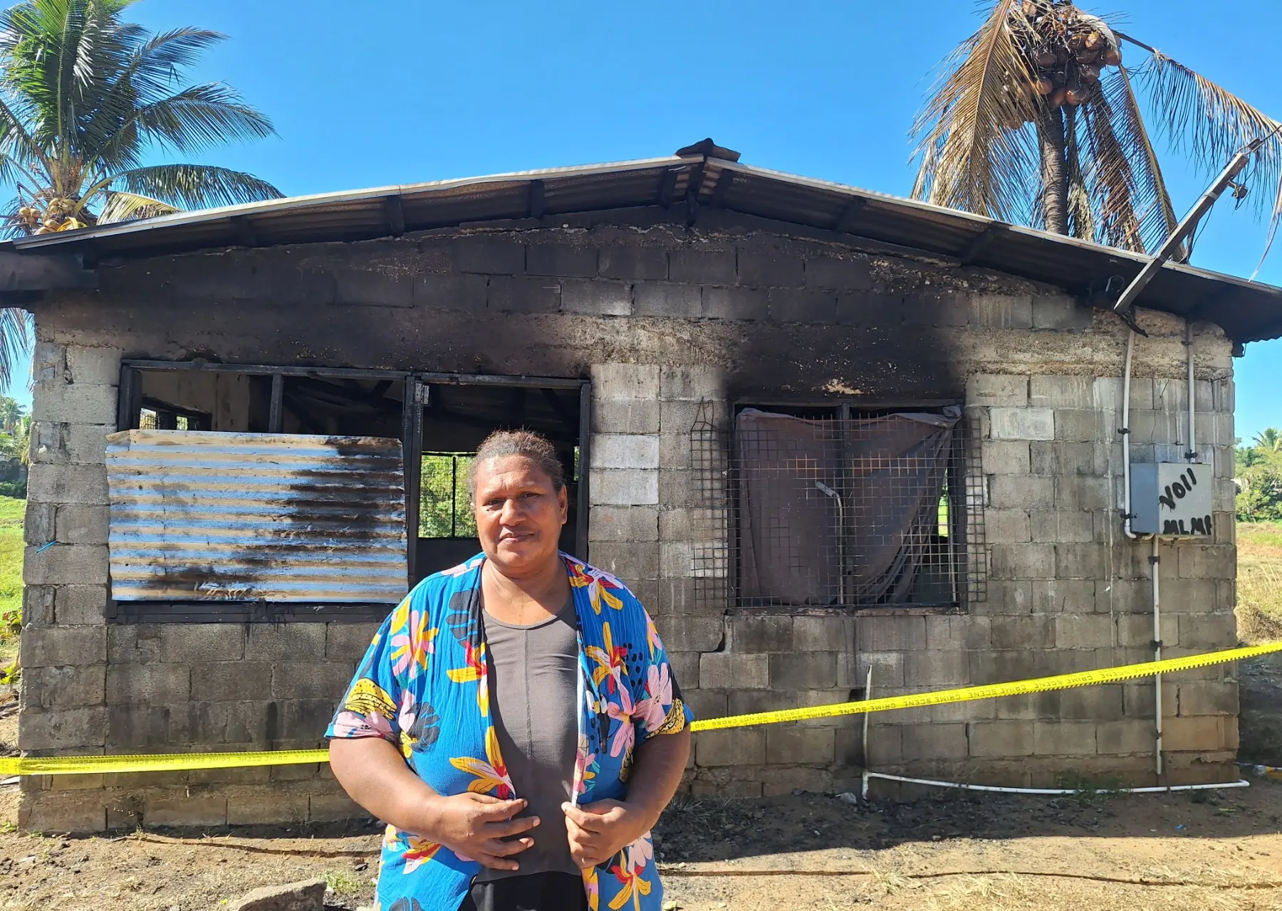 Mereisi Autiko, 49, in front of her fire-damaged home at Navakai Housing in Nadi.