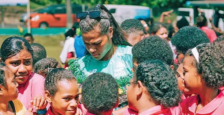 Rooster Chicken Fijiana Drua winger Laisani Moceisawana signs autographs at the Draiba Primary School in Suva on March 31 , 2023. Moceisawana was a former sprinting champion for Adi Cakobau School at the Coca-Cola Games. Photo: FRU Media