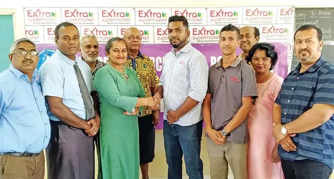 From left; Jasper Williams High School vice-principal Ranjeet Prasad, head coach Watisoni Delana, school manager Alfred Nand, principal Vanita Sharma, board member Suliasi Matavesi, Extra Supermarket manager Sheik Razak. Ravinesh Chandra, PTFA vice-president Parents Iliesa Ravudra, assistant principal Sneh Lata, PTFA president Donald Singh. Photo: Charles Chambers