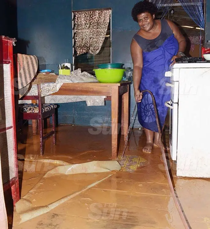 Meredani Nakayaca, 50 clean her house following flash flooding in Davuilevu, Nausori on March 9, 2021. Photo: Ronald Kumar.