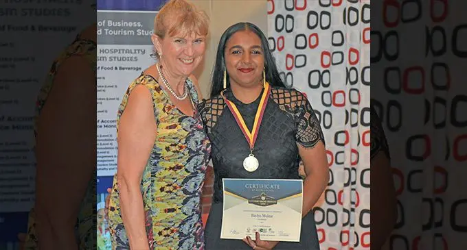 Fiji National University (FNU) student, Bavlyn Muktar ( right)