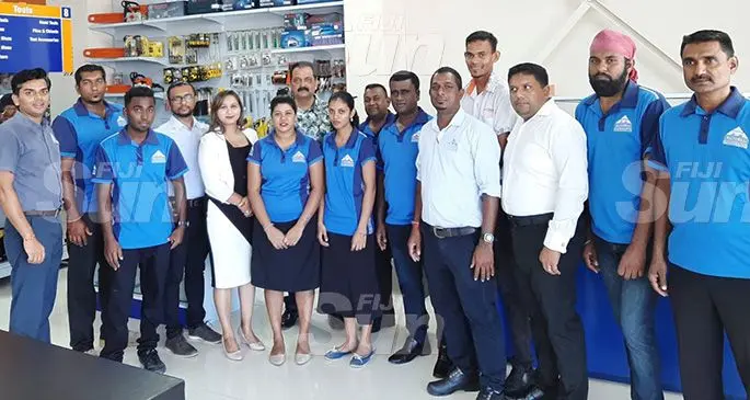 RC Manubhai Regional Manager West Premal Patel,( left) with Tavua branch staff after the reopening yesterday. Photo: Charles Chambers