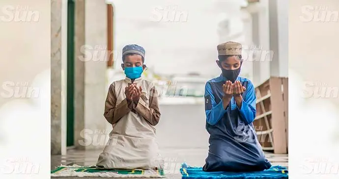 Muzammil Hamza Ali (left), with Ubaid Rahaman during prayers at the Fiji Muslim League Jame Mosque in Samabula, Suva on October 17, 2021. Photo: Leon Lord