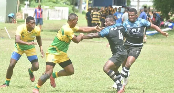Fiji Barbarians rep, Asaeli Tuivuaka tries to escape a tackle from a Wardens player during the Nawaka 7s at Prince Charles Park in Nadi on February 27, 2021. Photo: WAISEA NASOKIA.