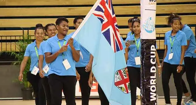 Fiji Pearls captain and flag bearer Alisi Naqiri leading the team during the official opening of the Vodafone Oceania World Cup qualifier on July 19, 2022. Photo: Netball Fiji