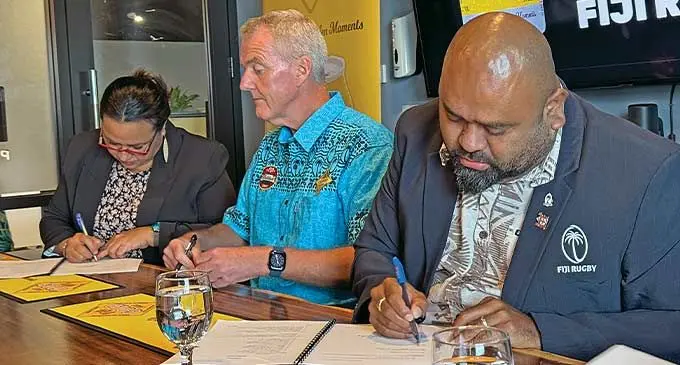 From left: Paradise Beverages head of marketing Etrina Simpson, general manager Mike Spencer and Fiji Rugby Union interim administrator Simione Valenitabua during the sponsorship signing at the Paradise Beverages boardroom, Walu Bay, Suva on March 5, 2024 . Photo: Sereana Salalo