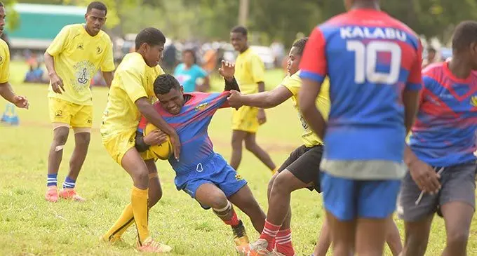 Lasarusa Matasau of Kalabu Roosters is cornered by the Naiyala Rabbitohs players in their Under-17 clash during the Fiji Secondary Schools rugby league competition at St Marcellin ground in Vatuwaqa, Suva, on May 14, 2022. Photo: Ronald Kumar.