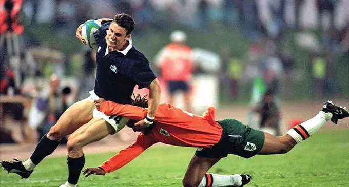 Max Brito (right), makes a tackle for the Ivory Coast, on Scotland’s Craig Joiner at the 1995 Rugby World Cup in South Africa.