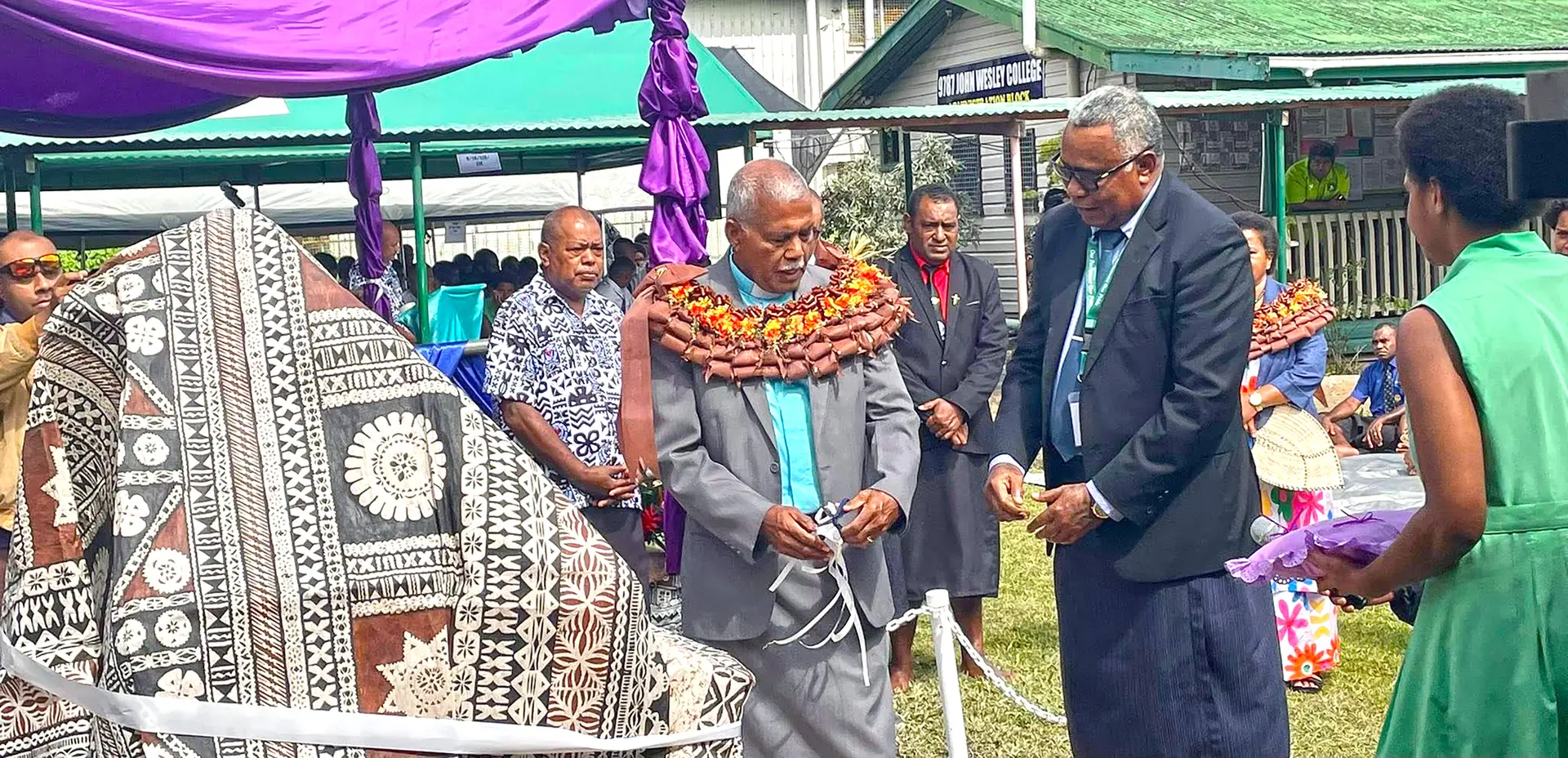 President of the Methodist Church in Fiji and Rotuma, Reverend Semisi Turagavou (garland), with Assistant Minister for Education Iliesa Vanawalu on May 21,2026.