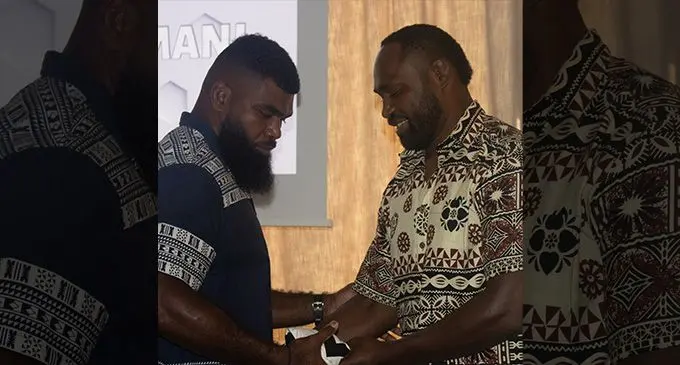 Flying Fijians backrower Albert Tuisue receives his jersey from former Flying Fijians team-mate Api Ratuniyarawa in Bordeaux, France, on September 29, 2023. Photo: FRU Media