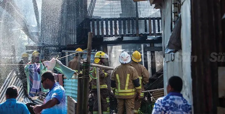 National Fire Authority officers continue to douse the burnt property with water after it was engulfed by flames at Veiquwawa Settlement in Raiwaqa, Suva, on March 16, 2025. Photo: Leon Lord