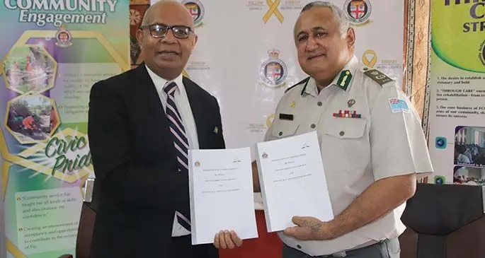 Seventh-day Adventist Church Fiji chairman Pastor Talemo Cakobau and Fiji Corrections Service Commisioner Commander Francis Kean during the Memorandum of Understanding signing on July 14, 2020. Photo: Fiji Corrections Service