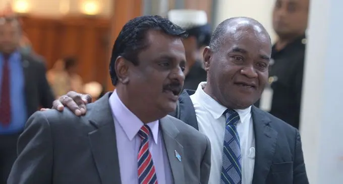 Minister for Employment, Productivity and Industrial Relations, Youth and Sports Parveen Kumar and Opposition MP Niko Nawaikula outside Parliament on November 27, 2018. Photo: Ronald Kumar