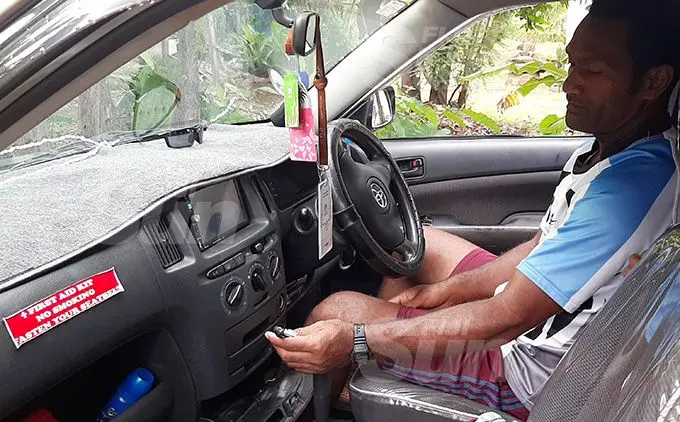 Adriu Naisiroki shows where the taxi metre was removed by the four robbers. Photo: Salote Qalubau