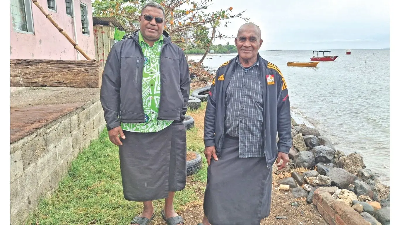 Navutu Community head Kamenieli Bainitabua (Black shirt) and Methodist Church steward (Nai Vakatawa) Solomoni Nacua (lime green shirt) at Navutu in Lautoka. 