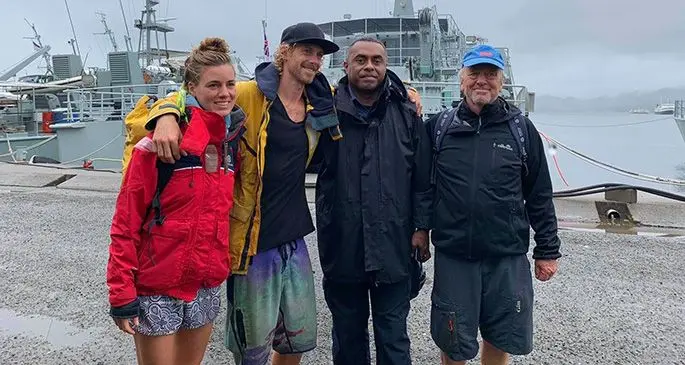 Lieutenant Sairusi Colati (Navy) with the three German nationals who were rescued by the Fijian Navy on October 25, 2019.