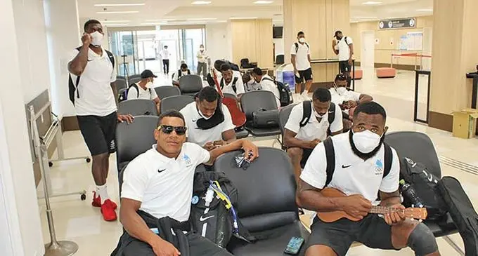 Team Fiji men's rugby sevens team (front) Napolioni Bola ca and Semi Radradra wait to get checked in at the Olympic Village on July 22, 2021. The team travelled from Oita to Tokyo to await today's opening ceremony of the Olympic Games Tokyo 2020. Their competition starts next Monday. Photo: FRU Media 
