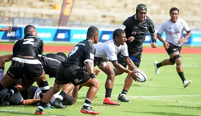 Taitusi Lulusini of Fijian Warriors clears the ball against  Fijian Under 20 side defense during first of their two part series at ANZ stadium on December 14, 2021. Photo: Ronald Kumar.