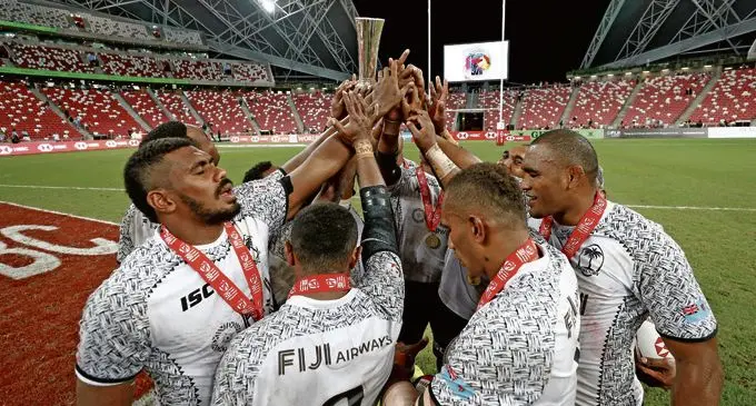 The Fiji Airways Fijian 7s team celebrate the Cup win over Australia on day two of the HSBC World Rugby Sevens Series in Singapore on April 29, 2018.  Photo: World Rugby