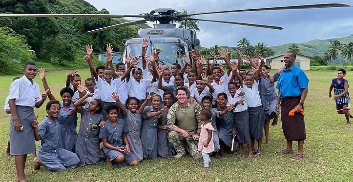 Royal New Zealand Air Force Squadron Leader Lachie Johnstone helped to deliver school books and equipment to Ratu Naivalu Memorial School, Yalobi during Operation Mahi Tahi in Fiji. Photo: Ravuama Nagalevu of Western Commissioners Office